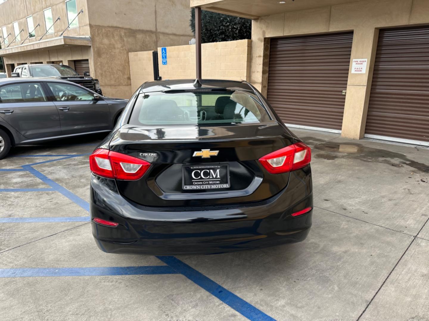 2017 Black /BLACK Chevrolet Cruze LS Auto (1G1BC5SM6H7) with an 1.4L L4 DOHC 16V TURBO engine, 6A transmission, located at 30 S. Berkeley Avenue, Pasadena, CA, 91107, (626) 248-7567, 34.145447, -118.109398 - Crown City Motors is a used “Buy Here Pay Here” car dealer in Pasadena CA. “Buy Here Pay Here” financing, means that when you purchase your vehicle from our dealership, that you make the payments to the dealership as well. We do not need the banks approval to get you approved for a used auto - Photo#3